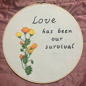 Jenna McKee's Audre Lorde on Love (and Poppies). Embroidered poppies on hoop with "Love has been our survival,"