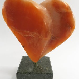 Rene Dayan-Whitehead's stone heart - orange alabaster on black marble base