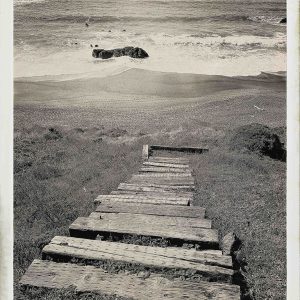Monica Kuhlman Jacobson's black and white photograph of wood steps leading to the beach