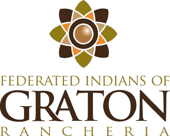 An image shows the logo for Graton Rancheria. At the top of the logo is a graphic made up of shapes representing a flower. The shapes are brown, orange, and green in muted hues. Below this is text which reads Federated Indians of Graton Rancheria
